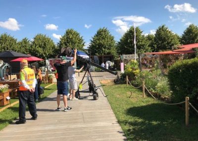 TV crew filming the Sensory Show Garden, capturing its design and features.