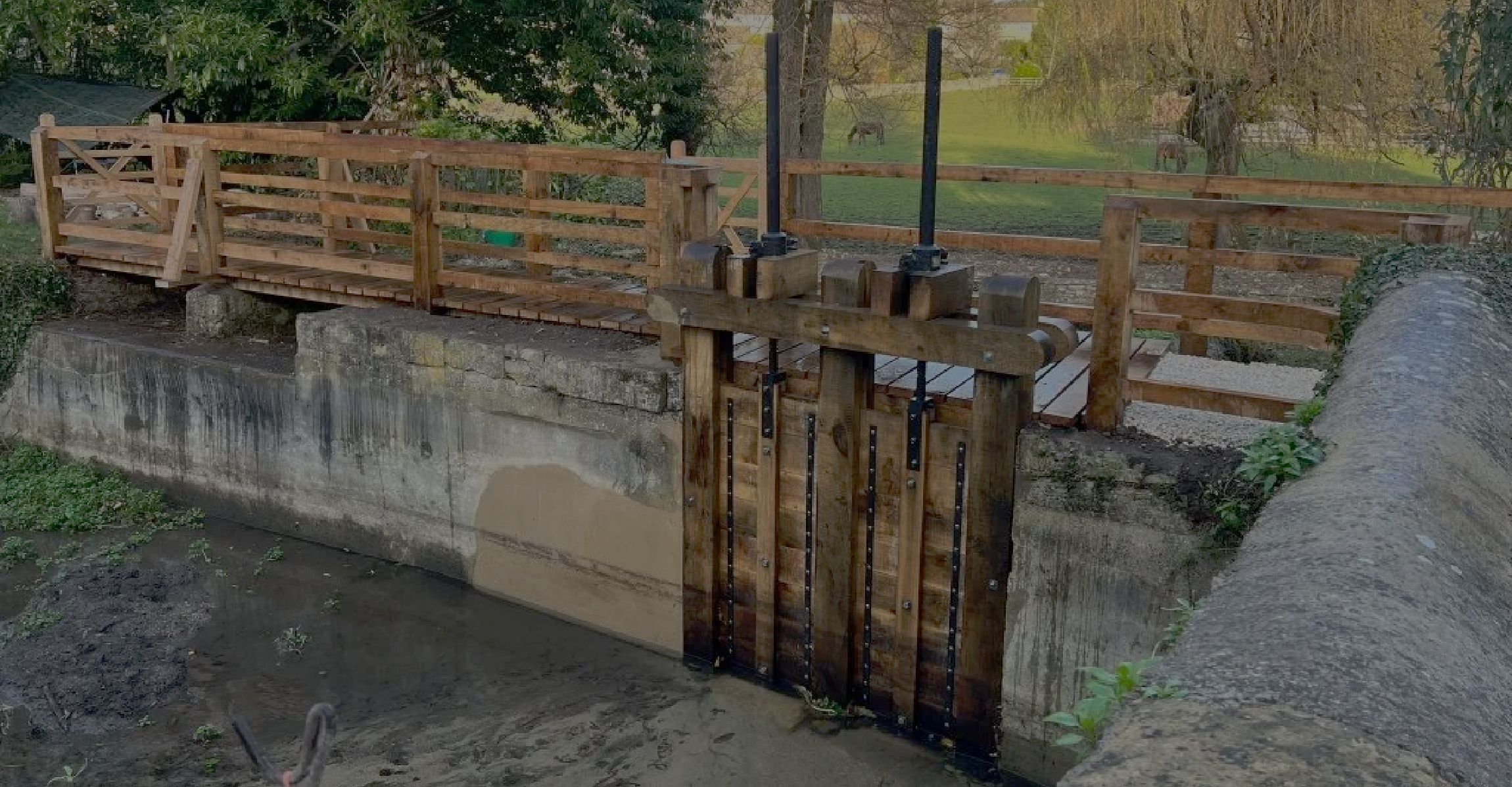 Background image of the sluice gate refurbishment project by Cotswold Estates and Gardens.