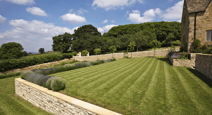 A beautifully maintained lawn by Cotswold Estates and Gardens.