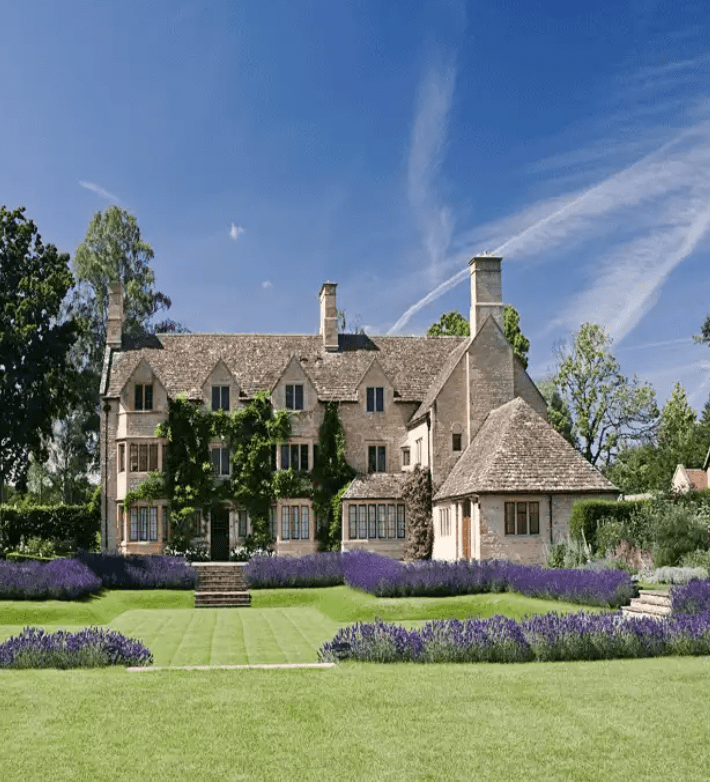 A sunken lawn with lavender borders in a garden designed by Cotswold Estates and Gardens.