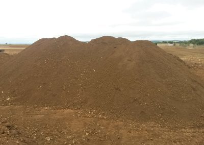 Earth modeling work in progress at Farmcote, showcasing the shaping of the landscape.