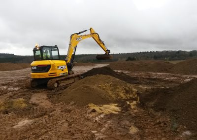 Earth modeling work in progress at Farmcote, showcasing the shaping of the landscape.