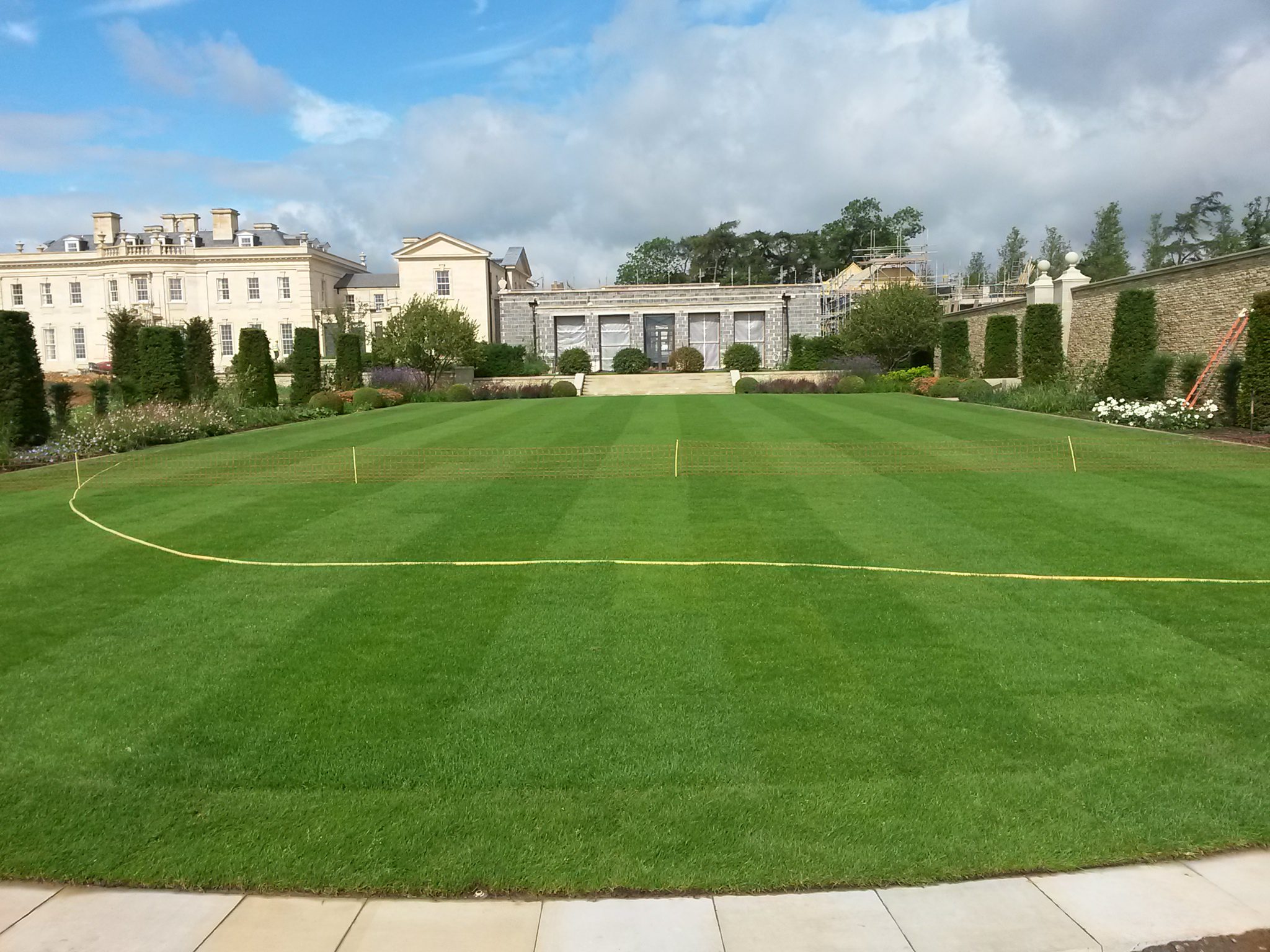 A stately home lawn, neatly maintained and showcasing lush, even grass.