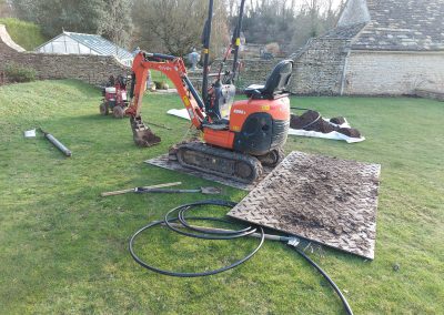 Irrigation system being installed in the ground.