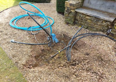 Irrigation system being installed in the ground.