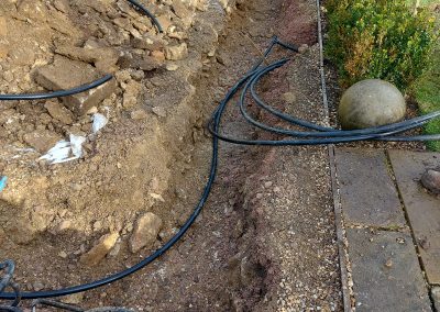 An irrigation pump installed in a garden setting.