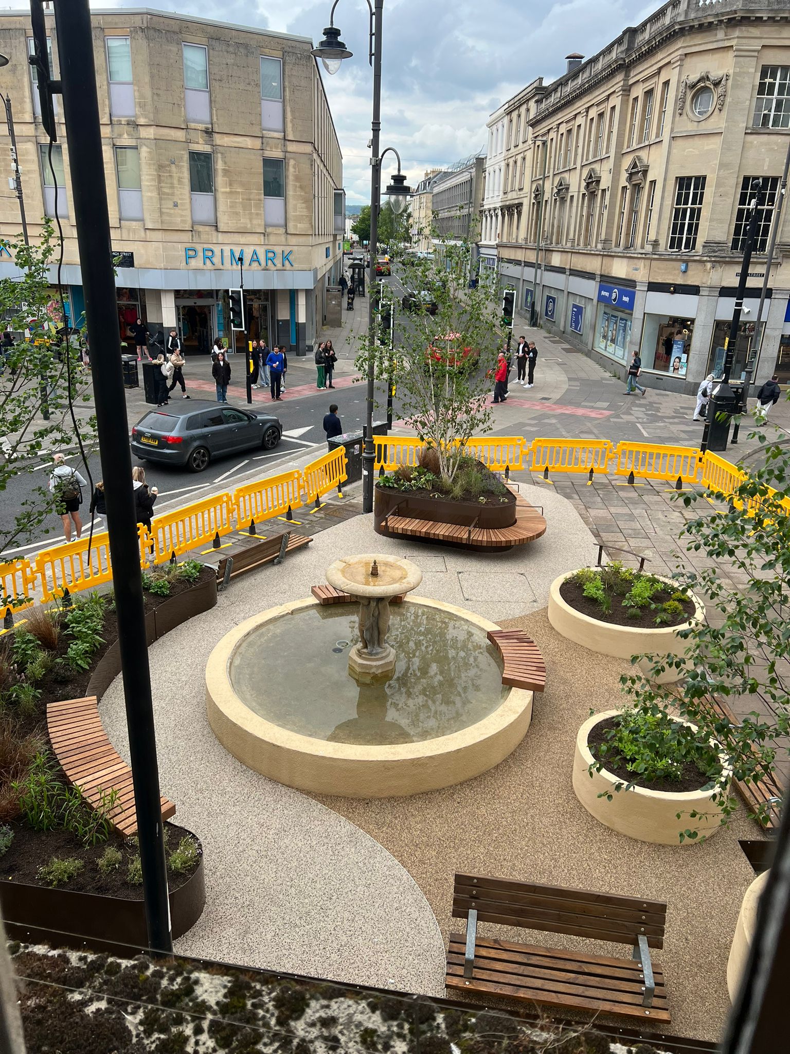 The completed outdoor area for Cheltenham Town Council, featuring landscaped gardens and public spaces.